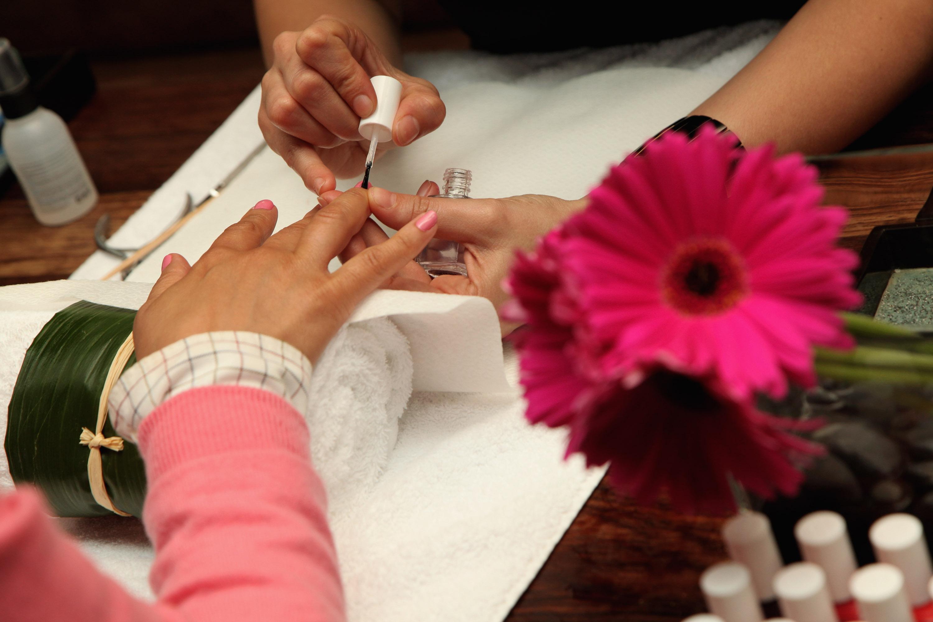 LONDON, ENGLAND - JUNE 10:  A woman has a manicure during the Designer Couture Trunk Show hosted by Noelle Reno at The Collection on June 10, 2009 in London, England.  (Photo by Tim Whitby/Getty Images)