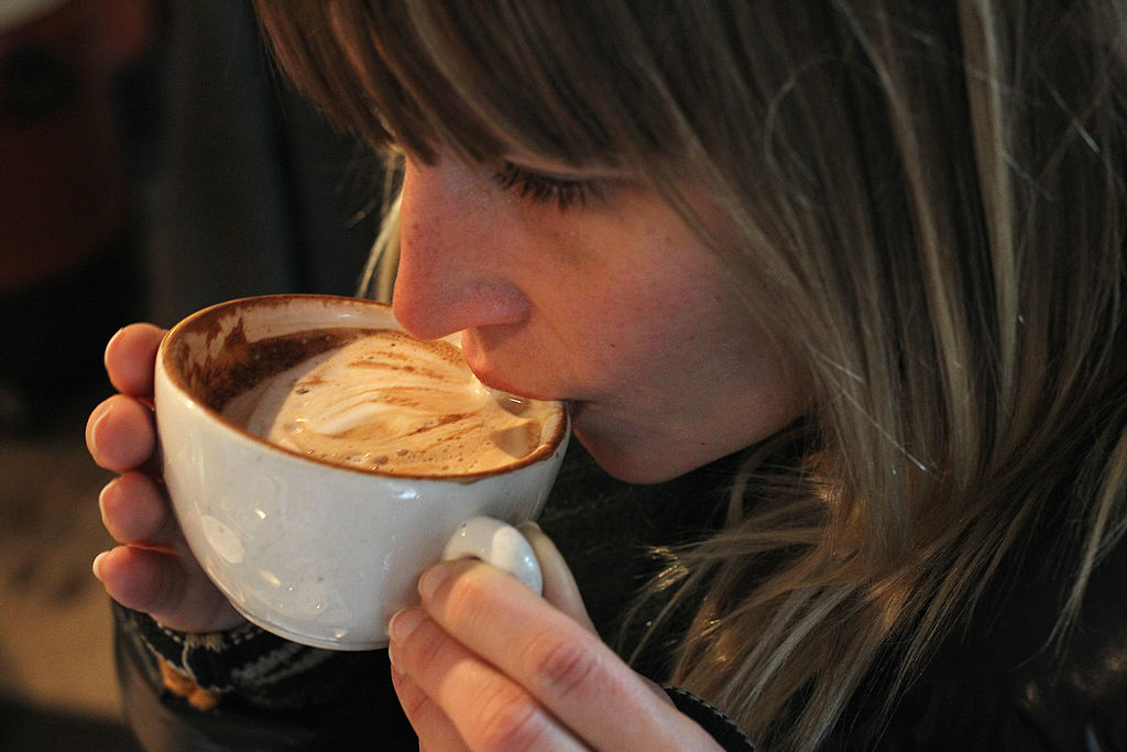 woman drinking a cup of coffee