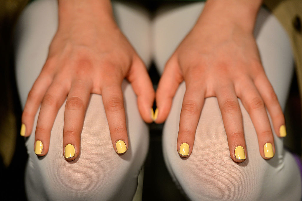 Young girl showing off her finger nails