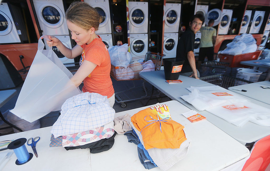 lady doing laundry at table