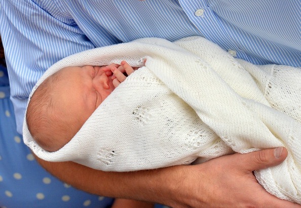 sleeping baby being held