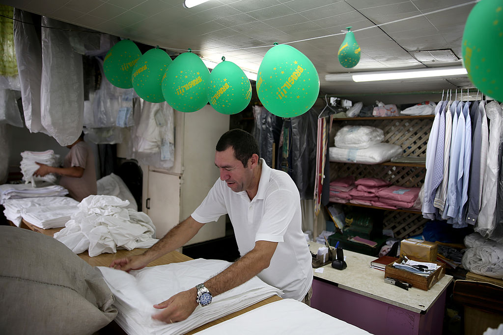 brazilian man washing clothes