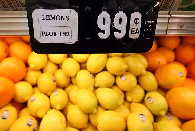 a bunch of lemons on display