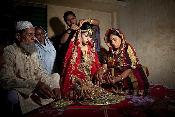 family in Bangladesh sitting on floor