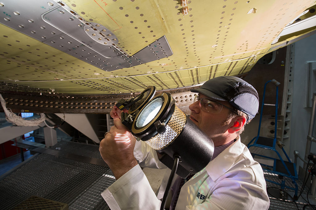 engineer inspecting airplane