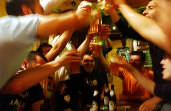 people toasting to a good night at a bar