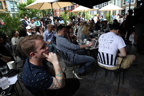 people sitting at an outdoor bar