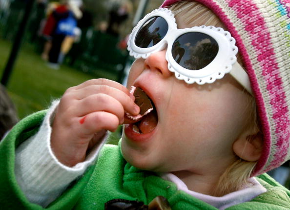 little kid eating candy