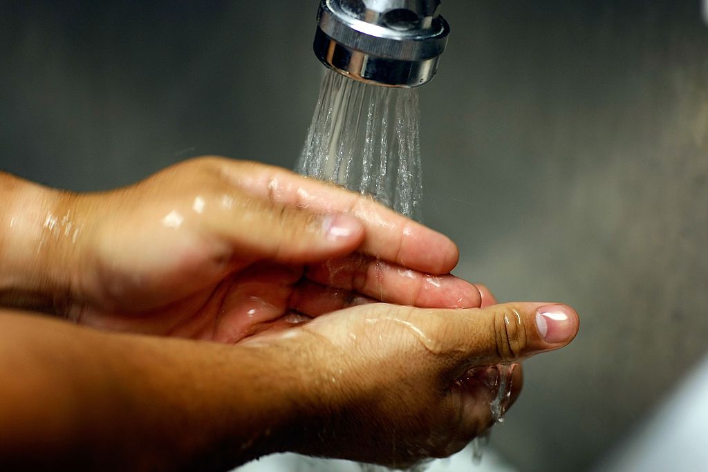 Person washing his/her hands in sink