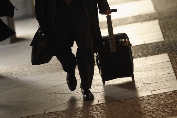 woman walking with luggage