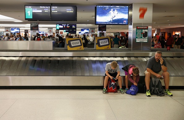 people waiting for lost luggage