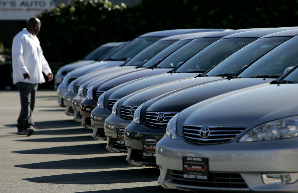 man looking at cars for sale