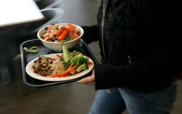 person carrying food tray