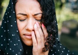 Woman in Black and White Polka Dot Hijab Crying