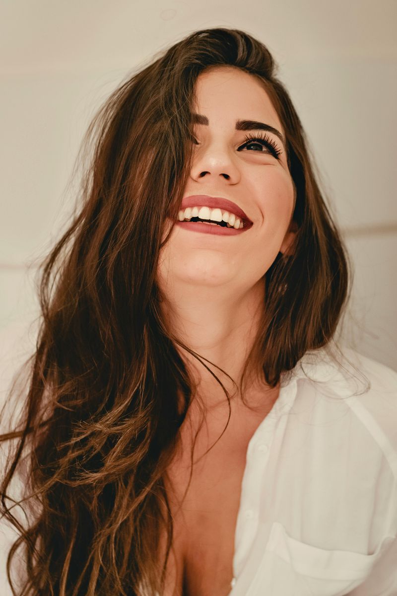 She Laughs at the Saddest Parts of Her Story