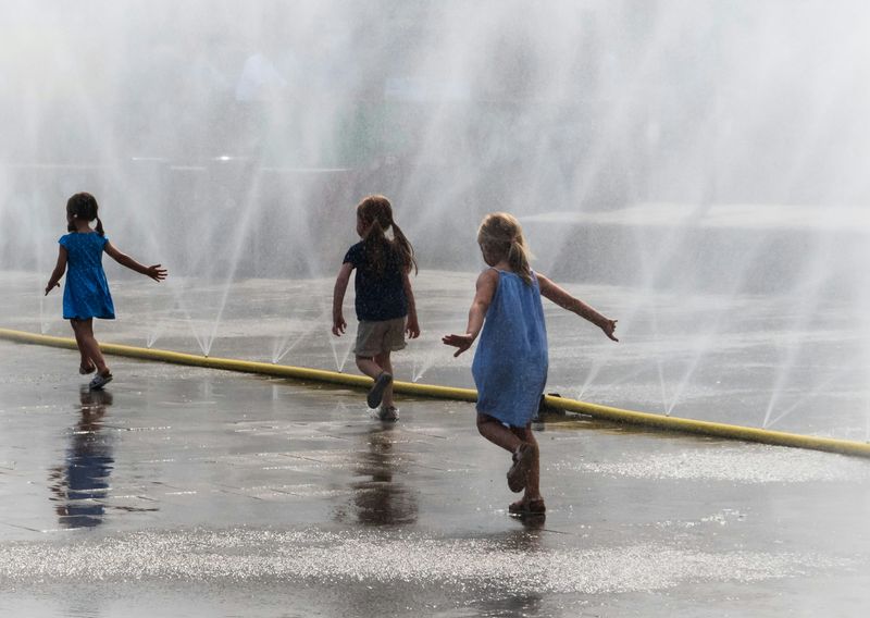Playing in Sprinklers and Water Hoses
