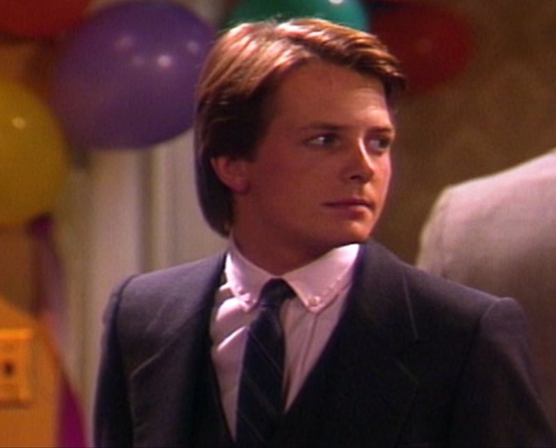 Michael J. Fox as Alex P. Keaton in Family Ties