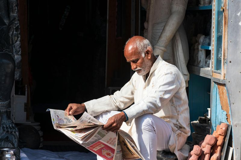 Reading the newspaper front to back